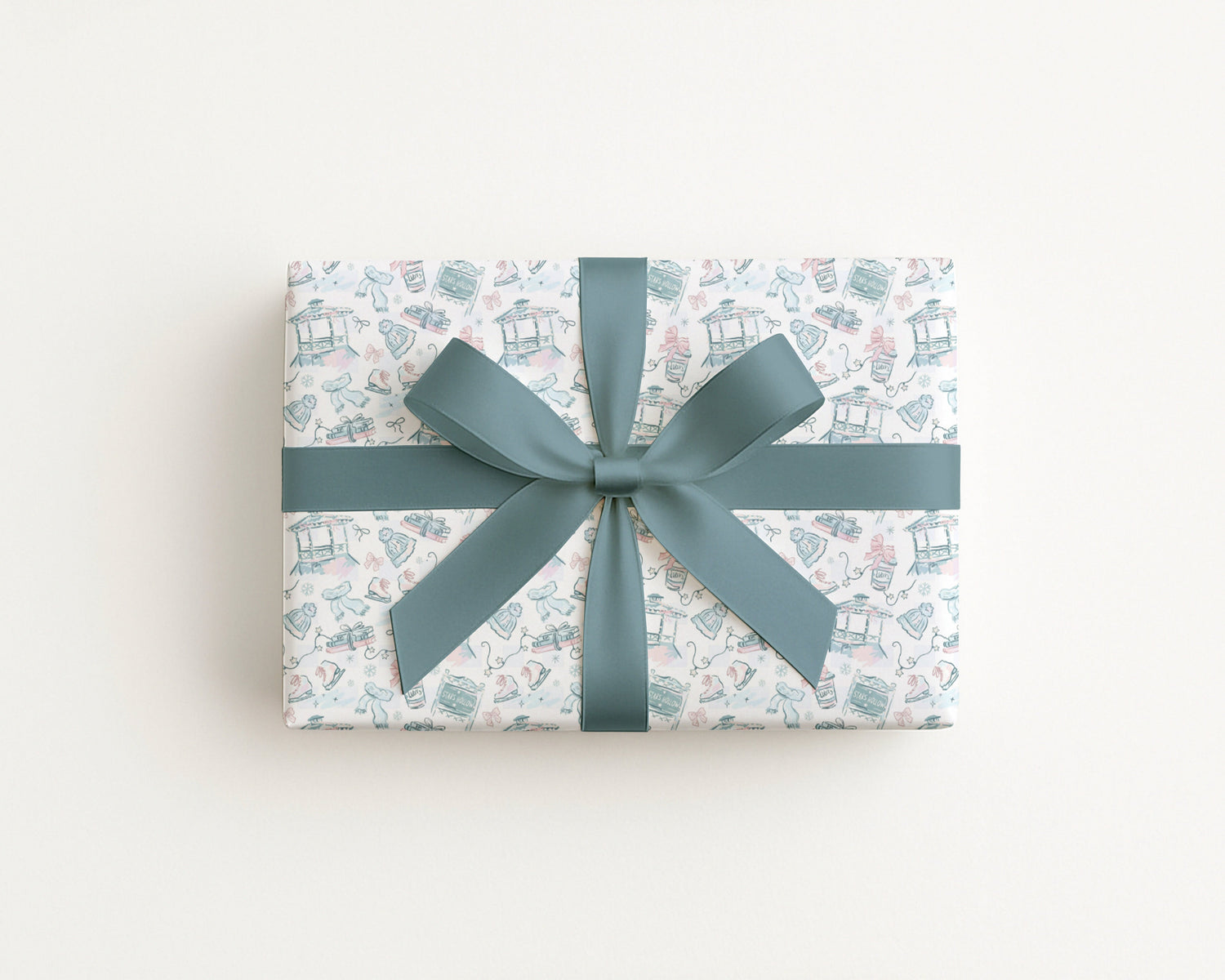 Best Sellers collection gift wrap featuring a stylish design with a teal ribbon on a present.