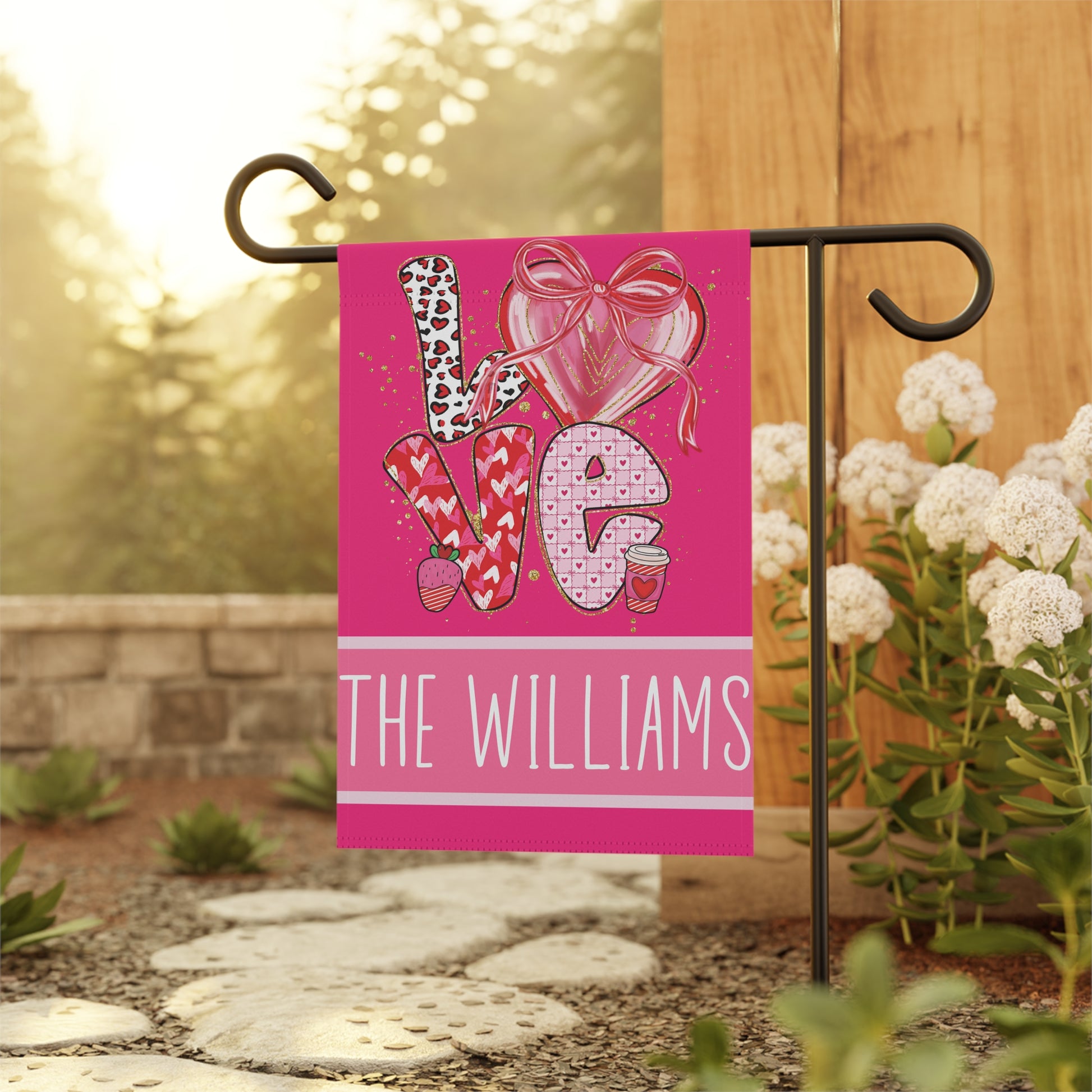 bright pink LOVE Valentines garden flag with hearts, strawberry and coffee cup details and personalized family name bar at bottom