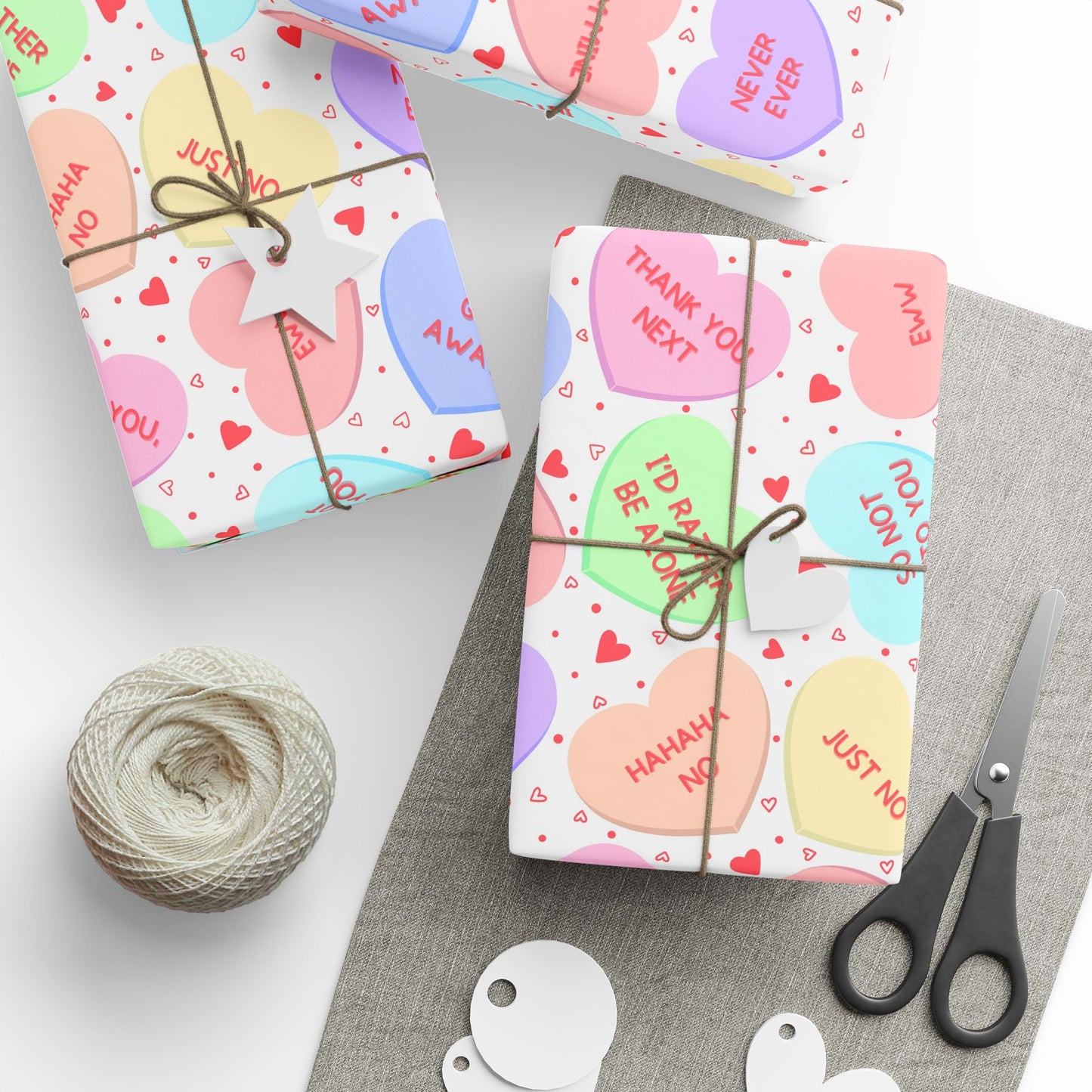 Wrapping paper — Galentines conversation-heart print with pastel candy hearts, one-sided 90gsm fine art paper, glossy or matte finish.