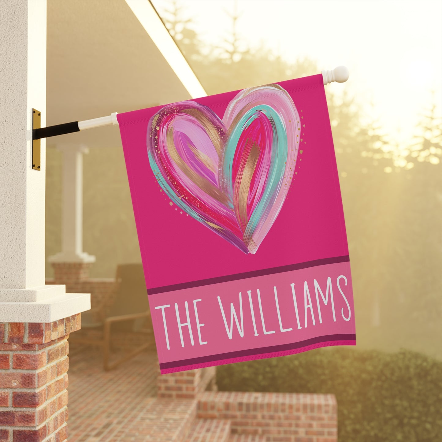 bright pink personalized heart garden flag with brushstroke heart artwork and custom family name bar at bottom