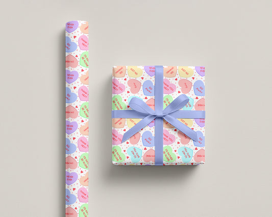 Wrapping paper — Galentines conversation-heart print with pastel candy hearts, one-sided 90gsm fine art paper, glossy or matte finish.