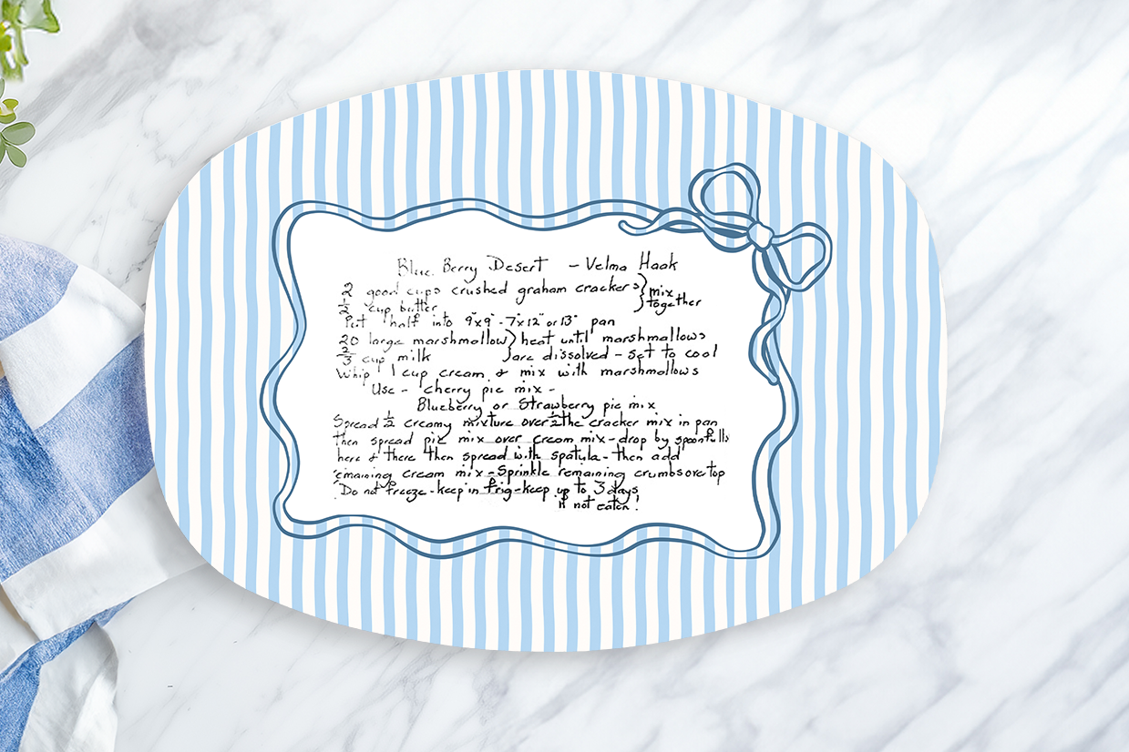 Blue and white striped placemat with text on a marble surface with a lemon and towel.