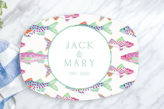 Personalized coastal serving platter featuring colorful watercolor fish and your custom family name. A durable serving tray perfect for beach houses, weddings, housewarmings, and entertaining.