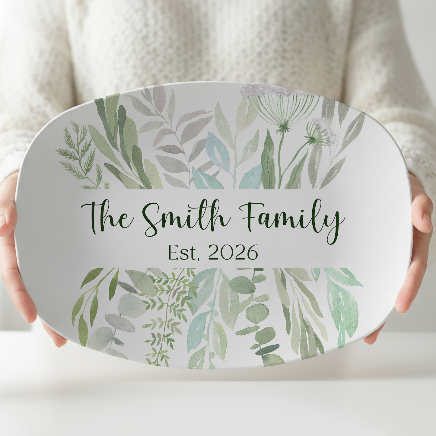 Personalized oval melamine serving platter featuring soft watercolor eucalyptus greenery with a custom family name and established year. Elegant botanical serving tray perfect for weddings, housewarming gifts, entertaining, and modern farmhouse kitchen décor.