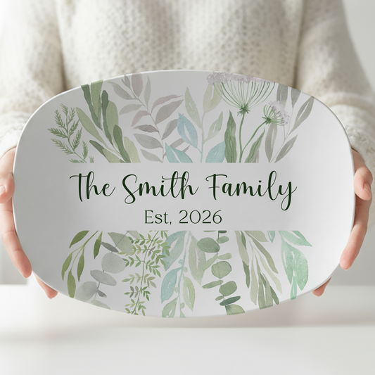 Personalized oval melamine serving platter featuring soft watercolor eucalyptus greenery with a custom family name and established year. Elegant botanical serving tray perfect for weddings, housewarming gifts, entertaining, and modern farmhouse kitchen décor.