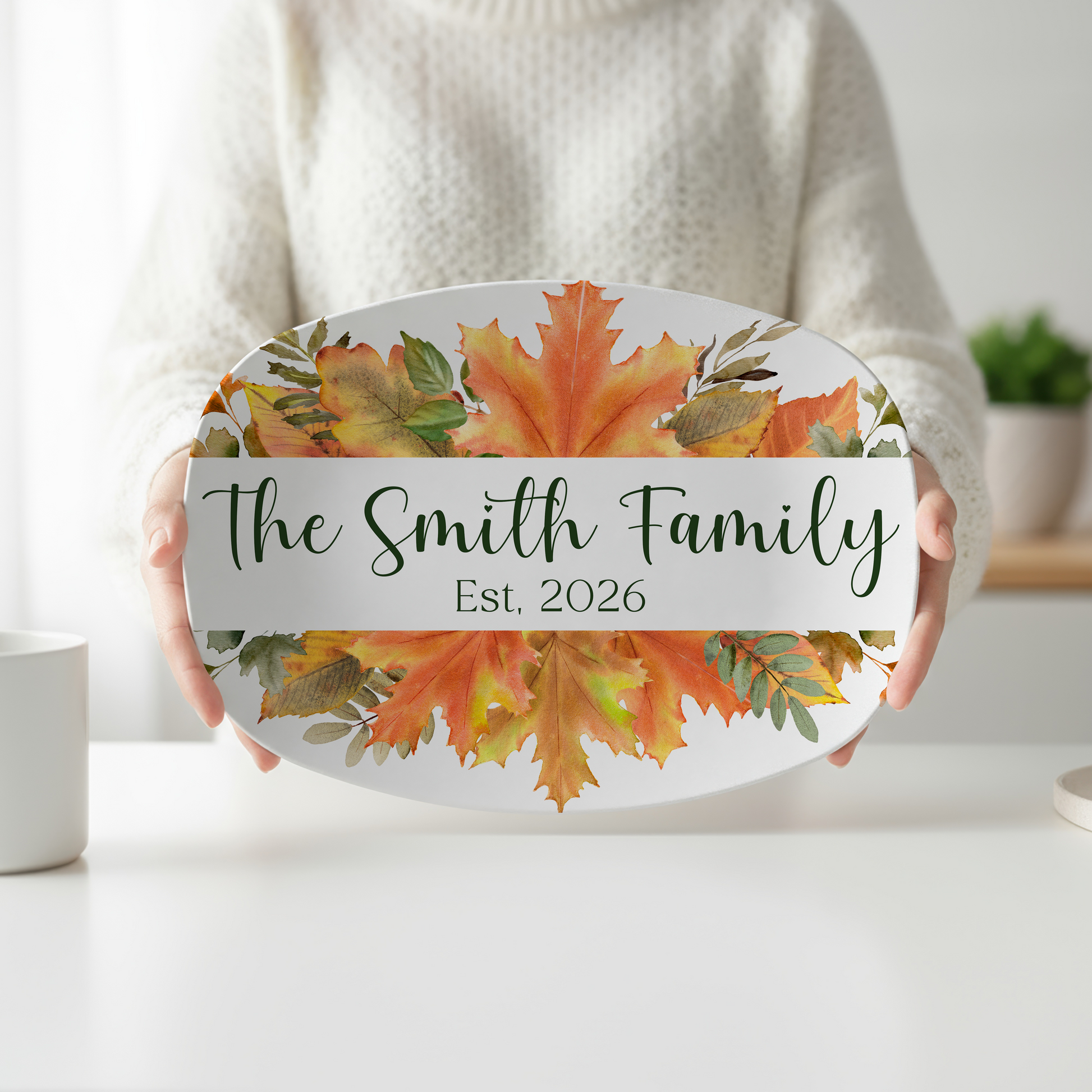 Personalized oval serving platter featuring vibrant watercolor maple leaves in autumn colors, custom family name, and optional established year. Fall serving tray perfect for Thanksgiving entertaining, hostess gifts, seasonal kitchen décor, and personalized family keepsakes.