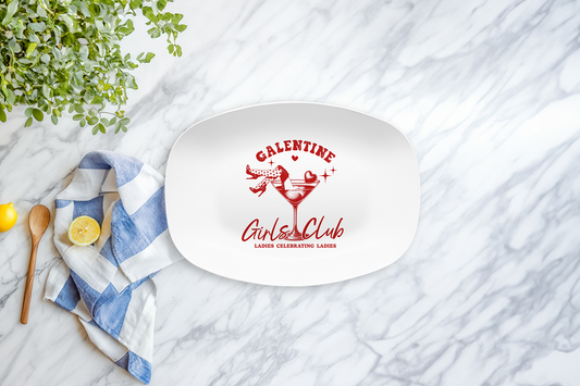 Platter with 'Galentine Girls Club' design on a marble surface with a lemon and towel.