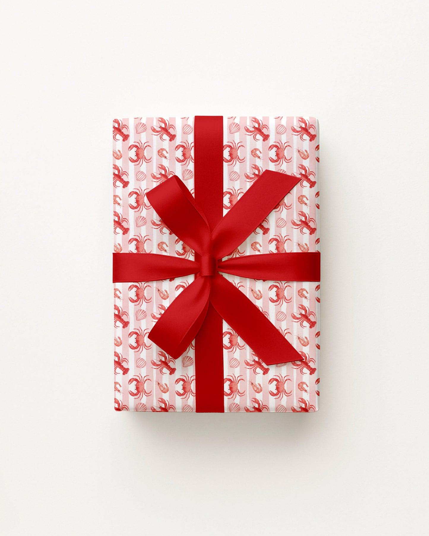 Gift box with red ribbon on a white background