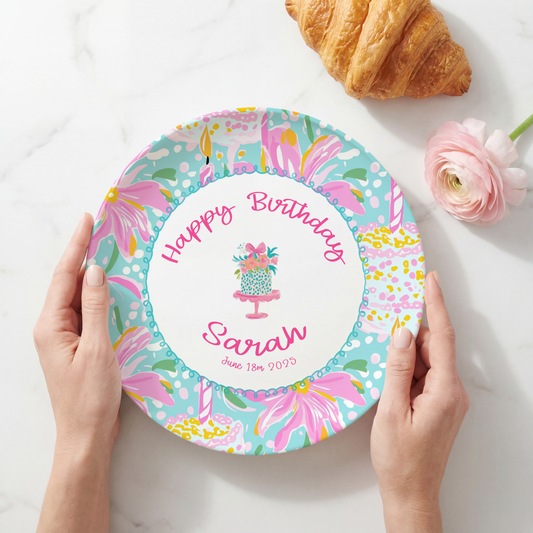 Personalized melamine birthday plate featuring a colorful pastel birthday cake pattern, custom name, and optional birth date, designed as a reusable keepsake for annual birthday celebrations.