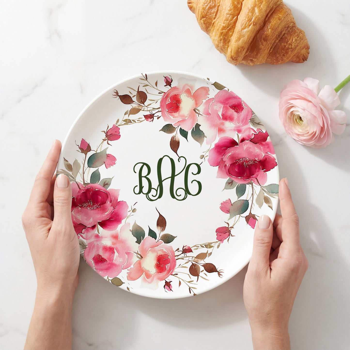 Personalized white plate featuring a vibrant watercolor wreath of pink roses and botanical greenery surrounding a custom three-letter monogram, creating an elegant floral plate perfect for weddings, housewarmings, Mother's Day, and personalized home décor.