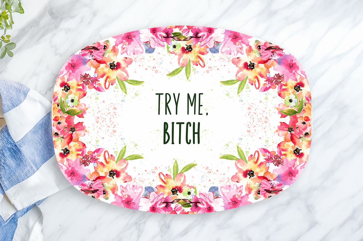 Floral-themed placemat with text on a marble surface with a lemon and towel.